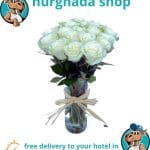 21 white roses in a glass vase, perfect floral arrangement for any special occasion.