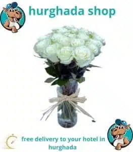 21 white roses in a glass vase, perfect floral arrangement for any special occasion.